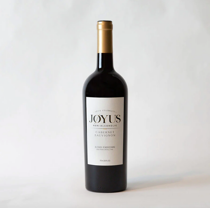 A bottle of wine. The label reads: "Let's celebrate! Joyus Non-Alcoholic Cabernet Sauvignon. Alcohol-removed wine."