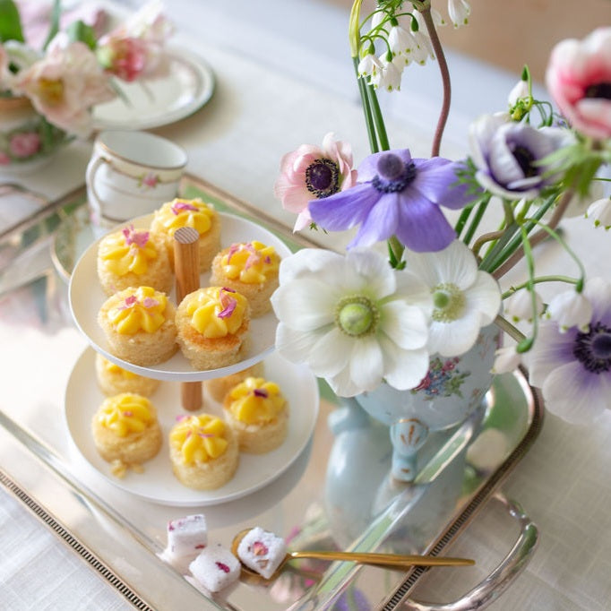 A tea tower filled with lemon cake bites.