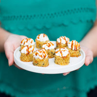 A platter of bite-sized cakes.